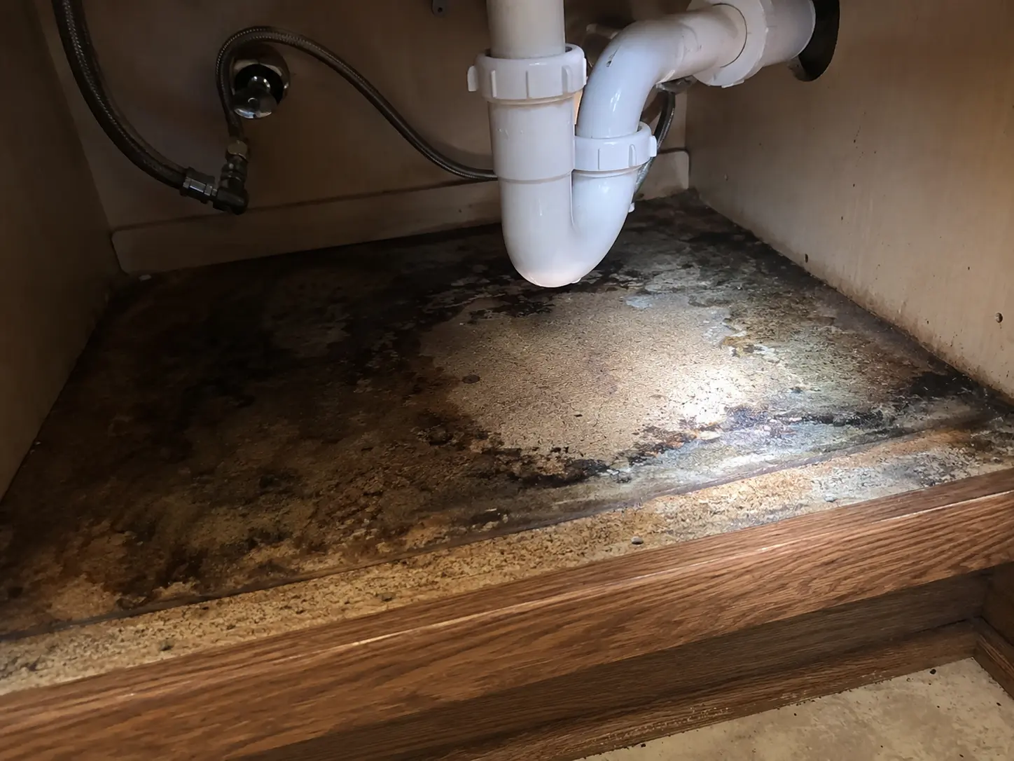 Water staining under the sink base
